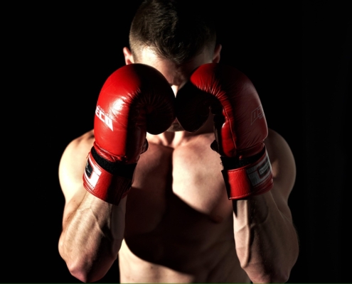 MMA fighters in a ring with betting odds overlay